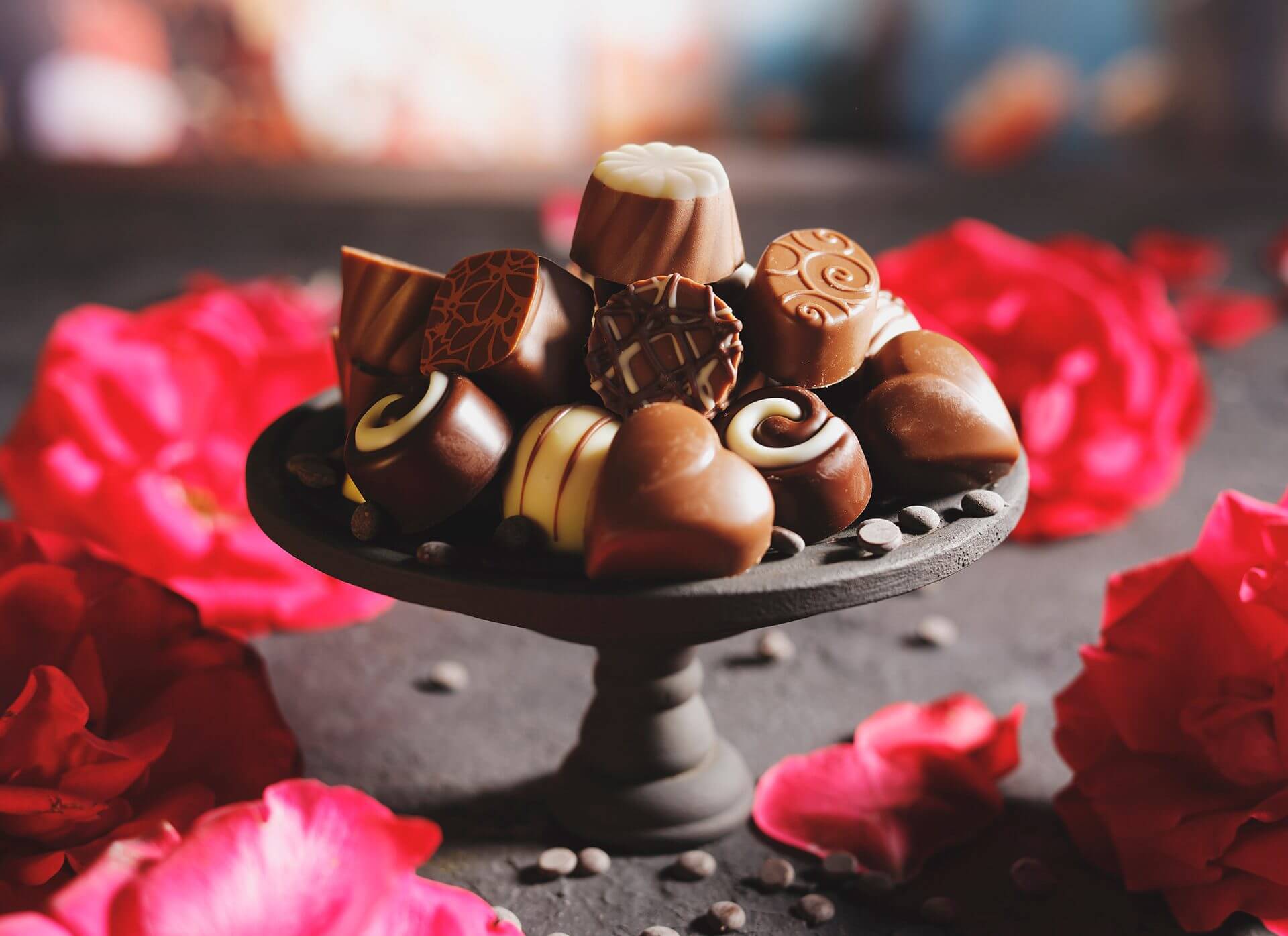 Gourmet chocolates surrounded by roses