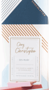 Menu card with elegant gold and blue design at Chez Christophe.